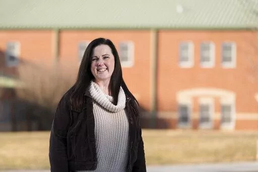 Kerry Mulvihill, a science teacher at Gerald Huesken Middle School poses for a portrait in Lancaster, Pa., Tuesday, Feb. 1, 2022. Mulvihill said only five people applied for an 8th-grade science position this fall and none of them made it to the interview stage. Two special education teachers recently resigned in the middle of the year, a formerly rare occurrence during her 25 years as a teacher, she said. “We really have a crisis,” Mulvihill said. “Now, I’m like, oh my golly. I’m begg