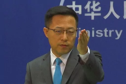 Chinese Foreign Ministry spokesperson Zhao Lijian gestures during a press conference at the Ministry of Foreign Affairs in Beijing on July 6, 2022. The United States is “the biggest threat to world peace, stability and development," China said Thursday,  July 7, continuing its sharp rhetoric in response to U.S. accusations of Chinese spying and threats to the international order.(AP Photo/Liu Zheng, File)
