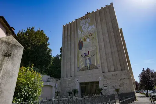A mosaic by ex-Jesuit artist Marko Rupnik is seen on the main facade of the Church of Our Lady of the Canadian Martyrs, June 28, 2024, in Rome. The Knights of Columbus, an influential Catholic charitable organization, announced Thursday, July 11, that it will cover up its mosaics made by a famous ex-Jesuit artist accused of abusing women as a sign of solidarity with victims of abuse. (AP Photo/Andrew Medichini, File)