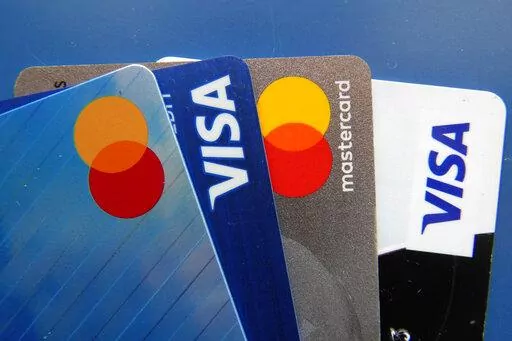 Credit cards as seen Thursday, July 1, 2021, in Orlando, Fla.  Record low-interest mortgages are long gone. Credit card rates will likely rise. You'll pay more for an auto loan. The unusually large three-quarter point hike, Wednesday, June 15, 2022 in the Fed's benchmark short-term rate is going to have a lot of impacts on Americans' finances. The hope is that by making borrowing more expensive, the Fed will succeed in cooling demand for homes, cars and other goods and services and slow inflatio