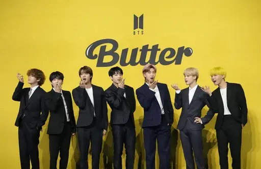 FILE- Members of South Korean K-pop band BTS, V, SUGA, JIN, Jung Kook, RM, Jimin, and j-hope from left to right, pose for photographers ahead of a press conference to introduce their new single "Butter" in Seoul, South Korea, Friday, May 21, 2021. South Korea has recently retaliated for North Korea's trash-carrying balloon launches with propaganda loudspeaker broadcasts at border areas. The South Korean broadcasts reportedly included K-pop sensation BTS’s mega hits like “Butter” and “Dyn