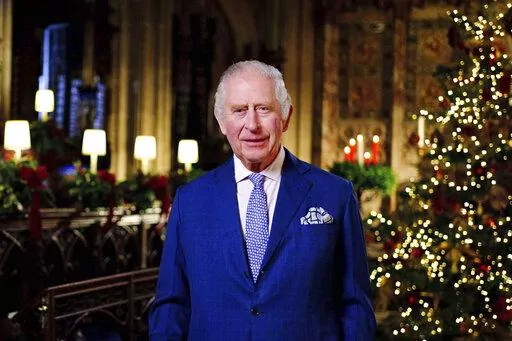 Britain's King Charles III delivers his message during the recording of his first Christmas broadcast in the Quire of St George's Chapel at Windsor Castle, Berkshire, England, Tuesday, Dec. 13, 2022. King Charles III evoked memories of his late mother, Queen Elizabeth II, as he broadcast his first Christmas message as monarch on Sunday, Dec. 25, 2022, in a speech that also paid tribute to the “selfless dedication” of Britain’s public service workers, many of whom are in a fight with the go