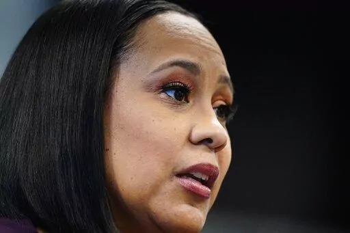 Fulton County District Attorney Fani Willis speaks during an interview at her office, Feb. 24, 2021, in Atlanta. The prosecutor who's investigating whether Donald Trump and others broke the law by trying to pressure Georgia officials to overturn Joe Biden's presidential election victory is asking the FBI for security help after the former president railed against prosecutors investigating him. (AP Photo/John Bazemore, File)