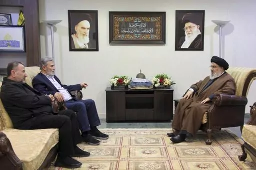 In this photo released on Oct. 25, 2023, by the Hezbollah Media Relations Office, Hezbollah leader Sayyed Hassan Nasrallah, right, meets with Ziad al-Nakhleh, the head of Palestinian Islamic Jihad, center, and Hamas deputy chief, Saleh al-Arouri, in Beirut. When the Lebanese militia Hezbollah announced last week that its leader Hassan Nasrallah would deliver his first public speech since the outbreak of the Israel-Hamas war, much of the region held its breath. (Hezbollah Media Relations Office, 