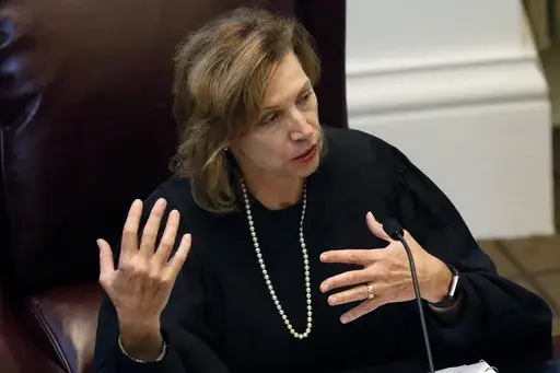 U.S. District Court Chief Judge Sharion Aycock of the Northern District of Mississippi, offers some observations to the student law school advocates that participated in a moot court competition between the state's two law schools, Mississippi College School of Law and the University of Mississippi School of Law in Jackson, Miss., Wednesday, Sept. 27, 2017. (AP Photo/Rogelio V. Solis, File)