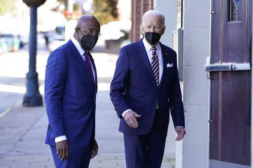 President Joe Biden and Sen. Raphael Warnock, D-Ga., enter Ebenezer Baptist Church, Jan. 11, 2022, in Atlanta. Warnock is senior pastor at the church. With Warnock having secured his first full term and Biden buoyed by Democrats' better-than-expected election results, the senator is welcoming the president back to Georgia and to America's most famous Black church. (AP Photo/Patrick Semansky, File)