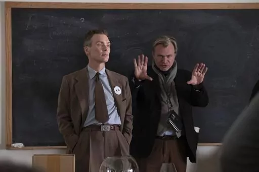 This image released by Universal Pictures shows writer-director-producer Christopher Nolan, right, and actor Cillian Murphy on the set of "Oppenheimer." (Melinda Sue Gordon/Universal Pictures via AP)