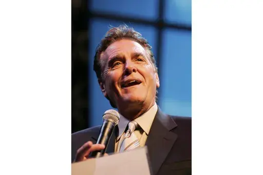Chuck Woolery hosts a special premiere of the "$250,000 Game Show Spectacular" at the Las Vegas Hilton Saturday, Oct. 13, 2007, in Las Vegas. (Ronda Churchill/Las Vegas Review-Journal via AP, File)