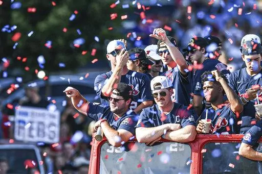 Mississippi baseball players celebrate its College World Series national championship in a parade in Oxford, Miss. on June 29, 2022. Mississippi is the defending national champion and returns star shortstop Jacob Gonzalez and many of the pitchers who appeared in the College World Series. (AP Photo/Bruce Newman, File)