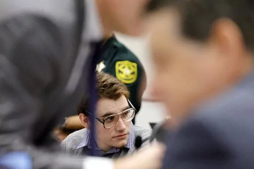 Marjory Stoneman Douglas High School shooter Nikolas Cruz is shown at the defense table during the penalty phase of Cruz's trial at the Broward County Courthouse in Fort Lauderdale, Fla., on Monday, Sept. 12, 2022. Cruz pleaded guilty to murdering 17 students and staff members in 2018 at Parkland's high school. The trial is only to determine if the 23-year-old is sentenced to death or life without parole. (Amy Beth Bennett/South Florida Sun-Sentinel via AP, Pool)