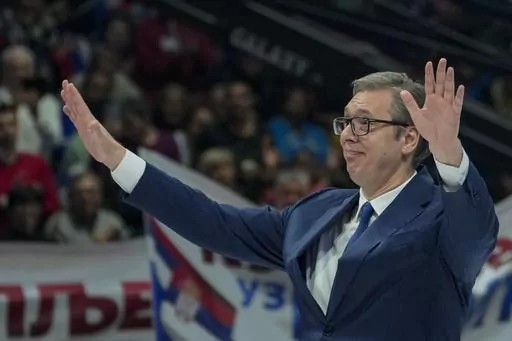 Serbian President Aleksandar Vucic waves to his supporters during a pre-election rally of his ruling Serbian Progressive Party in Belgrade, Serbia, Saturday, Dec. 2, 2023. Serbia's President Vucic is pushing hard to reassert his populist party's dominance at this weekend's early parliamentary and local elections that observers say are being held in an atmosphere of intimidation and media bias. (AP Photo/Darko Vojinovic)