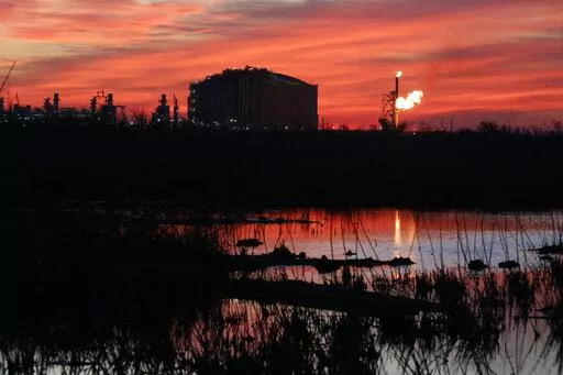 A flare burns at Venture Global LNG in Cameron, La., on April 21, 2022. Most major countries are finding it easier to promise to fight climate change than actually do it. (AP Photo/Martha Irvine, File)