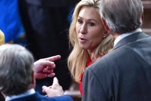 Lawmakers point at Rep. Marjorie Taylor Greene, R-Ga., after President Joe Biden delivered his first State of the Union address to a joint session of Congress at the Capitol, Tuesday, March 1, 2022, in Washington. (Jim Lo Scalzo/Pool via AP)