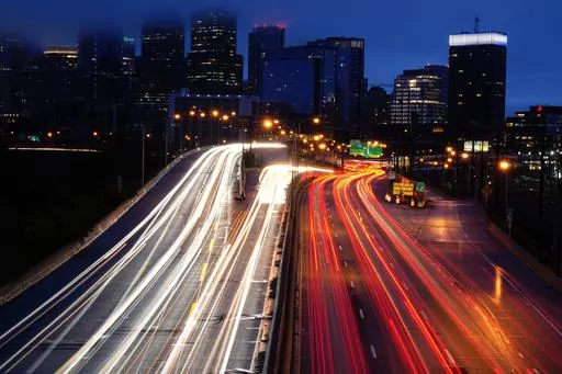 Vehicles move along Interstate 76 ahead in Philadelphia, Nov. 22, 2023. The energy used by cars and CO2 emissions could have dropped by over 30% in the past decade if not for the world’s growing taste for SUVs, a new report from the Global Fuel Economy Initiative suggests. (AP Photo/Matt Rourke, File)