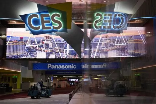 A worker drives down a hallway during preparations at the Las Vegas Convention Center before the start of the CES tech show, Monday, Jan. 2, 2023, in Las Vegas. (AP Photo/John Locher)