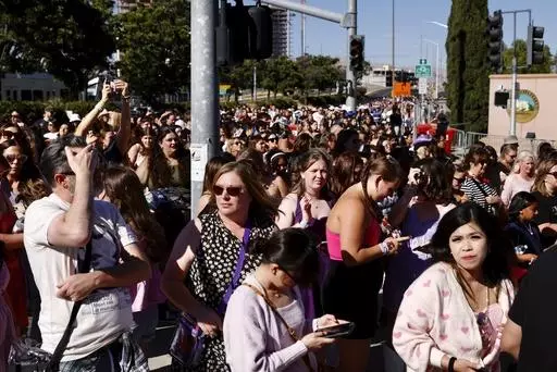 Fans wait to go through security before Taylor Swift performs at Levi's Stadium in Santa Clara, Calif. on July 28, 2023. The 2022 fiasco after there were a myriad of problems with fans trying to buy tickets for Swift's massive "Eras" tour shone a light on cracks in the ticketing system. (Jessica Christian/San Francisco Chronicle via AP, File)