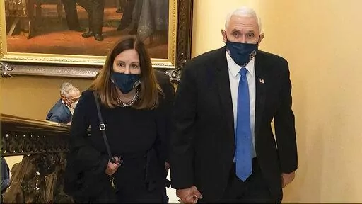 In this image from video released by the House Select Committee, Vice President Mike Pence and his wife Karen walk at the Capitol on Jan 6, that the House select committee investigating the Jan. 6 attack on the U.S. Capitol displayed June 16, 2022, on Capitol Hill in Washington. The subpoena to former Vice President Mike Pence is a milestone moment in an ongoing Justice Department special counsel investigation. But it doesn't guarantee he's going to be testifying before a grand jury anytime soon