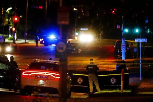 Memphis Police officers work an active shooter scene on Poplar Avenue in Memphis, Tenn. Wednesday, Sept. 7, 2022. Police in Memphis, Tennessee, said a man who drove around the city shooting at people during an hours-long rampage that forced frightened people to shelter in place Wednesday has been arrested. (Mark Weber/Daily Memphian via AP)