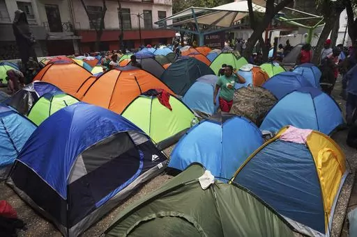 Haitian migrants camp out at the Giordano Bruno plaza in Mexico City, May 18, 2023. The group was staying at a shelter in Mexico City on their way north but were forced to make camp at the park after the shelter closed. (AP Photo/Marco Ugarte, File)