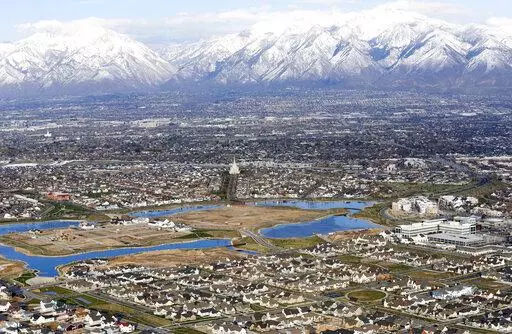 Homes in suburban Salt Lake City are shown, April 13, 2019. According to a new study released Monday, July 25, 2022, by the U.S. Census Bureau, by age 26 more than two-thirds of millennials lived in the same general area where they grew up, 80% had moved less than 100 miles away and 90% resided less than 500 miles away. (AP Photo/Rick Bowmer, File)