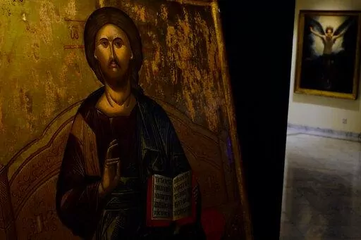 A looted 500 year-old Orthodox icon of the Enthroned Christ is seen at the Byzantine Museum after being returned, in capital Nicosia, Cyprus, on Tuesday, July 12, 2022. A 500 year-old Orthodox icon of the Enthroned Christ that was looted from a 12th century church in the breakaway north of ethnically divided Cyprus was repatriated after the end of a years-long legal journey from Zurich, Switzerland. (AP Photo/Petros Karadjias)