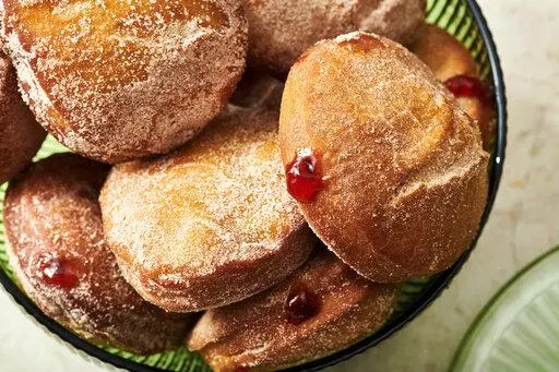 A plate of jelly doughnuts are displayed in New York on Nov. 15, 2021. In Jewish homes, jelly doughnuts are often enjoyed during Hanukkah and are known as Sufganiyot. (Cheyenne Cohen via AP)