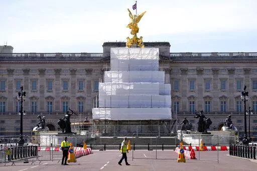 Building work in preparation for the Platinum Jubilee celebrations take place in front of Buckingham Palace in London, Friday, May 6, 2022. Britain's Queen Elizabeth II acceded to the throne on the death of her father King George VI on Feb. 6, 1952, and the Platinum Jubilee bank holiday weekend celebrations will take place on June 2-5. (AP Photo/Kirsty Wigglesworth)