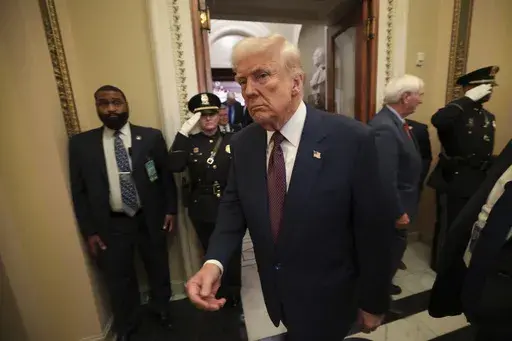 President Donald Trump leaves the chamber after addressing a joint session of Congress at the Capitol in Washington, Tuesday, March 4, 2025. (Win McNamee/Pool Photo via AP)