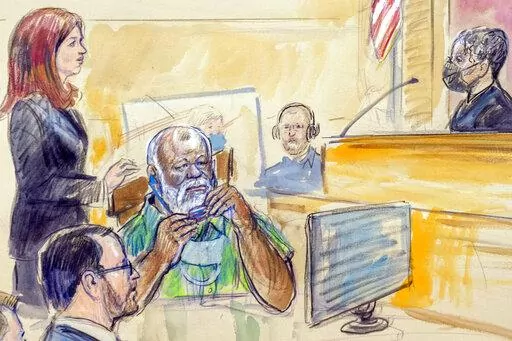 The artist sketch depicts Assistant U.S. Attorney Erik Kenerson, front left, watching as Whitney Minter, a public defender from the eastern division of Virginia, stands to represent Abu Agila Mohammad Mas'ud Kheir Al-Marimi, accused of making the bomb that brought down Pan Am Flight 103 over Lockerbie, Scotland, in 1988, in federal court in Washington, Monday, Dec. 12, 2022, as Magistrate Judge Robin Meriweather listens. Libyan officials say a powerful militia was involved in the clandestine det