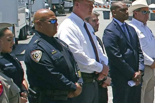 Uvalde School Police Chief Pete Arredondo, second from left, stands during a news conference outside of the Robb Elementary school in Uvalde, Texas, on May 26, 2022. The Uvalde school district’s police chief has stepped down from his position in the City Council just weeks after being sworn in following allegations that he erred in his response to the mass shooting at Robb Elementary School that left 19 students and two teachers dead.  (AP Photo/Dario Lopez-Mills, File)