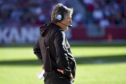 Mississippi State coach Mike Leach on the sidelines against Arkansas during an NCAA college football game Saturday, Nov. 6, 2021, in Fayetteville, Ark. Leach has signed a two-year contract extension through 2025 after leading the Bulldogs to their second consecutive bowl appearance, as confirmed by an MSU official on Wednesday, June 29, 2022. The third-year coach’s annual base salary increases from $5 million to $5.5 million. (AP Photo/Michael Woods, File)