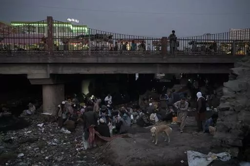 Afghans gather under a bridge to consume drugs, mostly heroin and methamphetamines in Kabul, Afghanistan, on Sept. 30, 2021. Afghanistan is the world’s fastest-growing maker of methamphetamine, a report from the United Nations drug agency said Sunday, Sept. 10, 2023. The country is also a major opium producer and heroin source, even though the Taliban declared a war on narcotics after they returned to power in August 2021.(AP Photo/Felipe Dana, File)