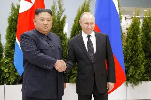 Russian President Vladimir Putin, right, and North Korea's leader Kim Jong Un shake hands during their meeting in Vladivostok, Russia, April 25, 2019. As the war in Ukraine stretches into its seventh month, North Korea is hinting at its interest in sending construction workers to help rebuild Russian-occupied territories in the country's east. (AP Photo/Alexander Zemlianichenko, Pool, File)