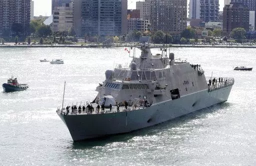The USS Detroit, a Freedom-class of littoral combat ship, arrives Friday, Oct. 14, 2016, in Detroit. The Navy that once wanted smaller, speedy warships to chase down pirates has made a speedy pivot to Russia and China and many of those ships, like the USS Detroit, could be retired. The Navy wants to decommission nine ships in the Freedom-class, warships that cost about $4.5 billion to build. (AP Photo/Carlos Osorio, File)