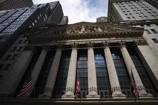 Statues adorn the facade of the New York Stock Exchange, July 14, 2022, in New York.  Stocks are opening lower on Wall Street, putting the S&P 500 index on track to break a four-week winning streak. The benchmark index was off 0.9% in the early going Friday, Aug. 19.  (AP Photo/John Minchillo, File)