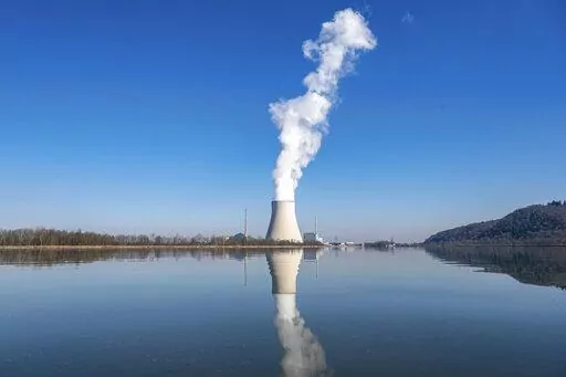 The nuclear power plant (NPP) Isar 2 is pictured in Essenbach, Germany, Thursday, March 3, 2022. Rising concern over the impact of a potential Russian gas cutoff is fueling an intensifying debate in Germany over whether the country should switch off its last three nuclear power plants as planned at the end of this year. (Armin Weigel/dpa via AP, File)