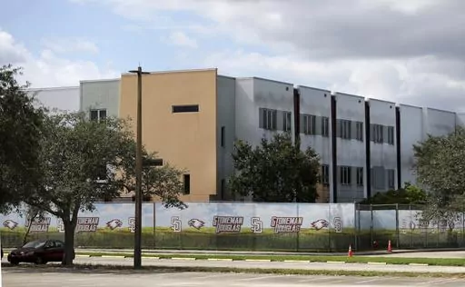 The 1200 building at Marjory Stoneman Douglas High School in Parkland, Fla., is seen, Oct. 20, 2021. The school building where 14 students and three staff members were fatally shot in a 2018 massacre is set to be demolished next summer, officials announced Thursday, Sept. 21, 2023. The demolition of Marjory Stoneman Douglas High School’s 1200 building, which has remained closed and locked behind a fence since the shooting, is scheduled to take place immediately following the conclusion of the 