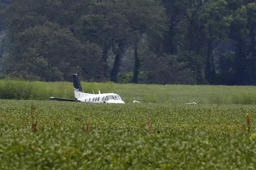 A stolen airplane rests in a field of soybeans after crash-landing near Ripley, Miss., on Saturday, Sept. 3, 2022. Authorities say a man who stole a plane and flew it over Mississippi after threatening to crash it into a Walmart store faces charges of grand larceny and terroristic threats. Tupelo Police Chief John Quaka said Cory Wayne Patterson didn't have a pilot's license but had some flight instruction and was an employee of Tupelo Aviation.(AP Photo/Nikki Boertman)