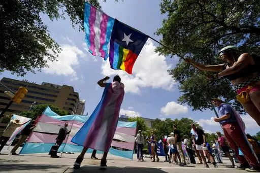 Demonstrators gather on the steps to the State Capitol to speak against transgender-related legislation bills being considered in the Texas Senate and Texas House, May 20, 2021 in Austin, Texas. No texts or emails that leave paper trails. Unusually close oversight. Texas child welfare workers who have quit over Republican Gov. Greg Abbott's first-of-its-kind directive in the U.S. to investigate families of transgender youth for abuse say rushed new protocols appear designed to tilt the outcome o