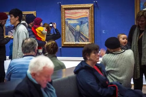 People look at Edvard Munch's "The Scream" at the National Gallery in Oslo, Norway, Sunday Jan. 13, 2019. On Friday, Nov. 11, 2022, activists from the organization ''Stopp oljeletinga'' (Stop Oil Exploration) tried to glue themselves to the frame of the painting. (Heiko Junge/NTB Scanpix via AP, file)