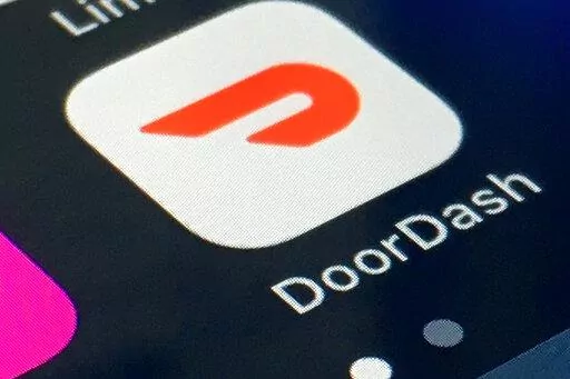 The DoorDash app is shown on a smartphone on Feb. 27, 2020, in New York. Delivery company DoorDash said Tuesday, March 15, 2022, it will refund its drivers for some U.S. gasoline purchases to help offset higher prices at the pump. (AP Photo/File)