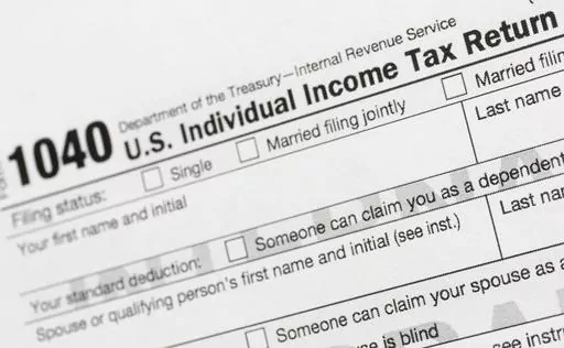 A portion of the 1040 U.S. Individual Income Tax Return form is shown July 24, 2018, in New York. The IRS has been tasked with looking into how to create a government-operated electronic free-file tax return system for all. Congress has directed the IRS to report in on how such a system might work. (AP Photo/Mark Lennihan, File)