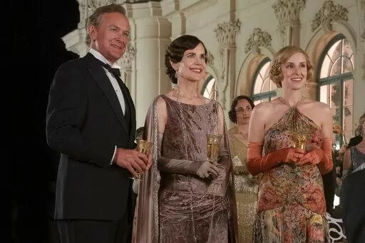 This image released by Focus Features shows Hugh Bonneville, from left, Elizabeth McGovern and Laura Carmichael in a scene from "Downton Abbey: A New Era." (Ben Blackall/Focus Features via AP)