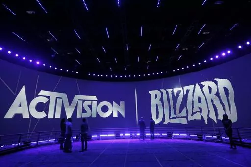The Activision Blizzard Booth during the Electronic Entertainment Expo in Los Angeles, June 13, 2013. British regulators have blocked Microsoft's $69 billion deal to buy videogame maker Activision Blizzard over worries that it would stifle competition in the cloud gaming market.. (AP Photo/Jae C. Hong, File)