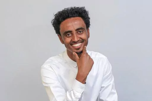Freelance video journalist Amir Aman Kiyaro, who is accredited to The Associated Press and has been in detention since November 2021 without charges, poses for a photograph in Ethiopia on Oct. 17, 2021. Kiyaro was freed on bail Friday, April 1, 2022 after the country's Supreme Court on Thursday upheld the ruling to grant him bail, rejecting a police effort to block his release. (AP Photo, File)