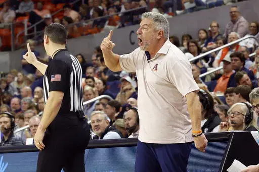 Auburn head coach Bruce Pearl, right, reacts after a call during the second half of an NCAA college basketball game against Florida, Saturday, Feb. 8, 2025, in Auburn, Ala. (AP Photo/Butch Dill)