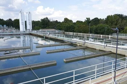 Clouds are reflected off the City of Jackson's O.B. Curtis Water Treatment Facility's sedimentation basins in Ridgeland, Miss., Sept. 2, 2022. As the most populous city in Mississippi attempts to improve its troubled water system, it has appointed a new interim director to lead the agency that runs local infrastructure. (AP Photo/Rogelio V. Solis, File)