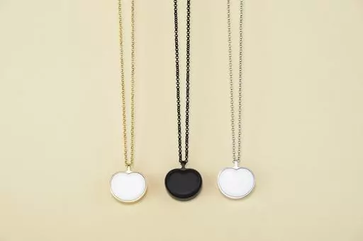 This image provided by Bond-Touch shows the Bond Heart smart necklace, which stores and plays heartbeats with the help of an app. Think outside the box for Mother's Day gifts this year. (Bond-Touch via AP).