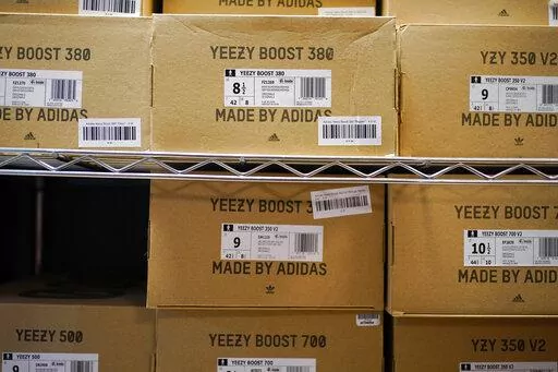 Boxes containing Yeezy shoes made by Adidas are seen at Laced Up, a sneaker resale store, in Paramus, N.J., Tuesday, Oct. 25, 2022. Adidas’ breakup with rapper Kanye West and the inability to sell his popular Yeezy line of shoes helped batter the company’s earnings at the end of last year. The German shoe and sportswear maker said Wednesday, March 8, 2023, that higher supply costs and slumping revenue in China also helped lead to a net loss of 513 million euros or $540 million in the fourth 
