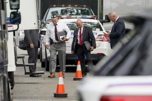 Authorities search the home of suspect Rex Heuermann, Tuesday, July 18, 2023, in Massapequa Park, As new details emerge about how police finally caught the alleged Gilgo Beach serial killer, they've also raised questions about whether investigators adequately pursued a key lead that may have helped solve the case sooner. (AP Photo/John Minchillo, File)